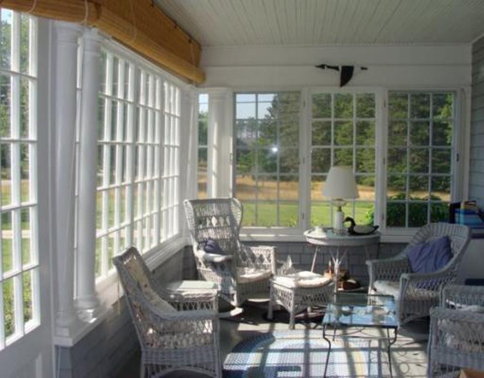 122 Point Road Hancock, ME 04640 - Photo 8 of 13 Front glassed-in porch with...