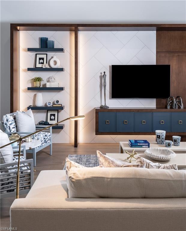 18300 Blue Eye Loop Fort Myers, FL 33913 - Photo 13 of 49 a living room with furniture and a flat screen tv