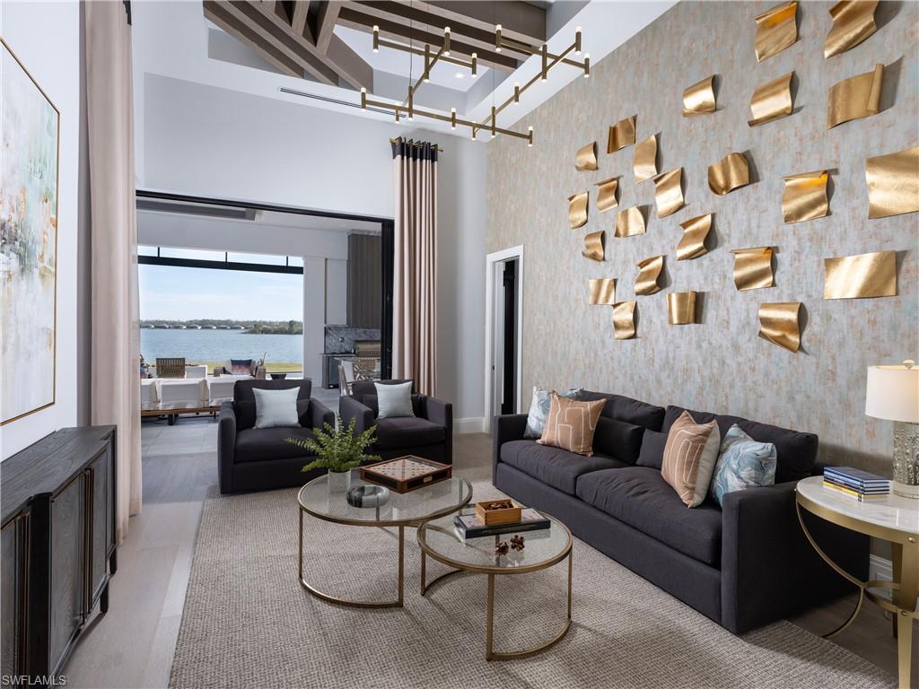 18300 Blue Eye Loop Fort Myers, FL 33913 - Photo 14 of 49 a living room with furniture and a chandelier