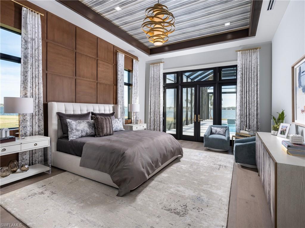 18300 Blue Eye Loop Fort Myers, FL 33913 - Photo 23 of 49 a spacious bedroom with a large bed and a couch