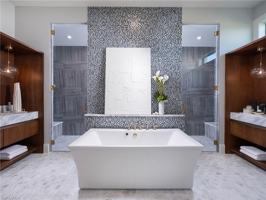 18300 Blue Eye Loop Fort Myers, FL 33913 - Photo 25 of 49 a spacious bathroom with a tub sink and mirror