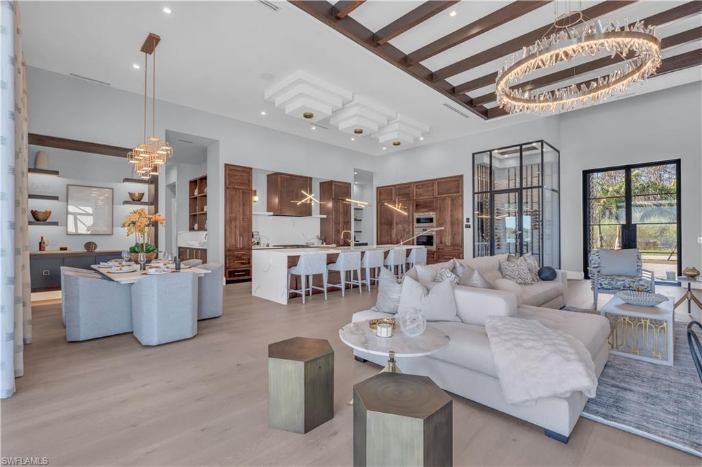 18300 Blue Eye Loop Fort Myers, FL 33913 - Photo 8 of 49 a living room with furniture and a chandelier