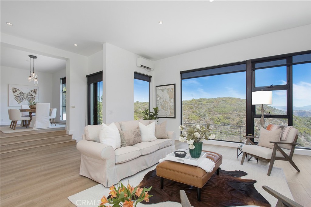 773 Barracuda Way Laguna Beach, CA 92651 - Photo 1 of 38 a living room with furniture and a large window