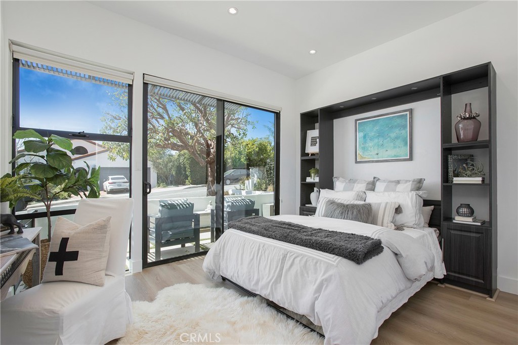 773 Barracuda Way Laguna Beach, CA 92651 - Photo 19 of 38 a bedroom with a large bed and a large window