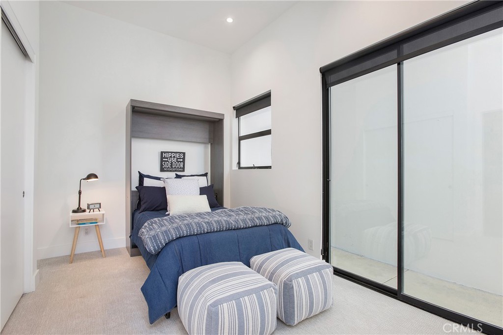 773 Barracuda Way Laguna Beach, CA 92651 - Photo 21 of 38 a bedroom with a bed and a painting