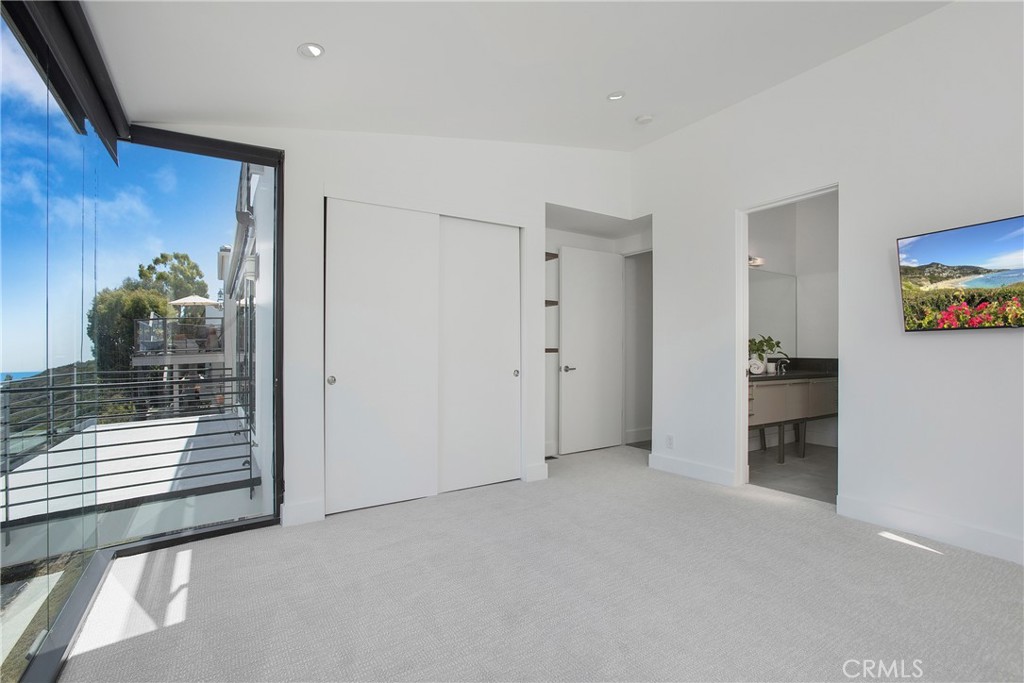 773 Barracuda Way Laguna Beach, CA 92651 - Photo 25 of 38 a view of empty room with wooden floor and cabinet