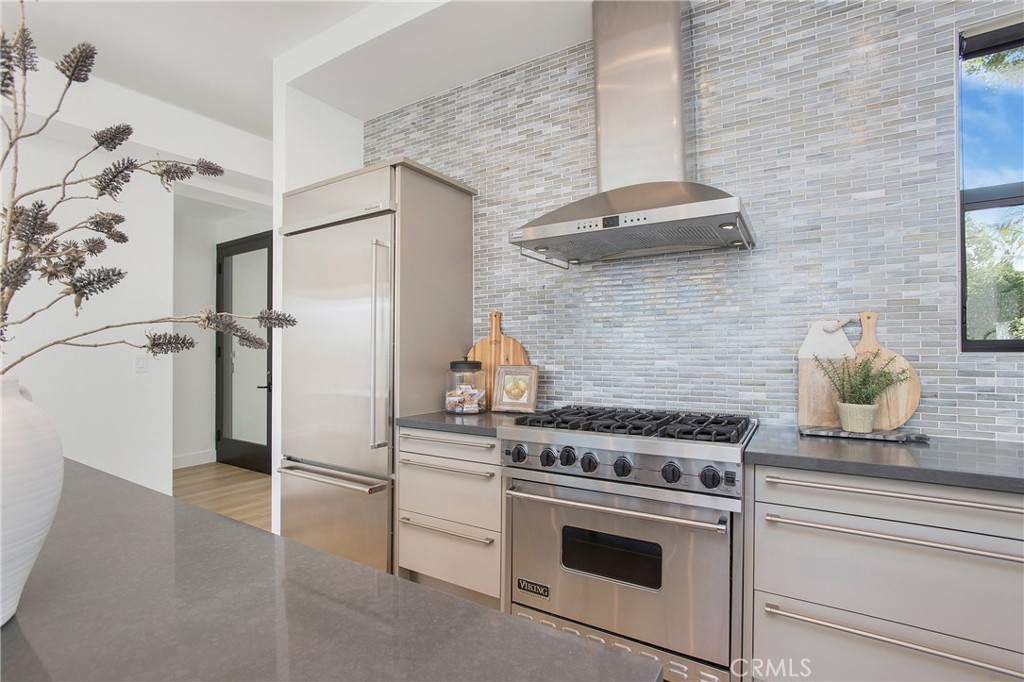 773 Barracuda Way Laguna Beach, CA 92651 - Photo 8 of 38 a kitchen with stainless steel appliances a stove and a refrigerator
