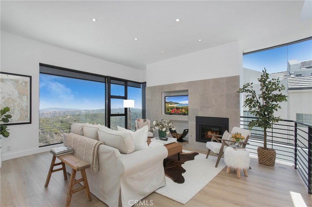 773 Barracuda Way Laguna Beach, CA 92651 - Photo 10 of 38 a living room with furniture and a fireplace