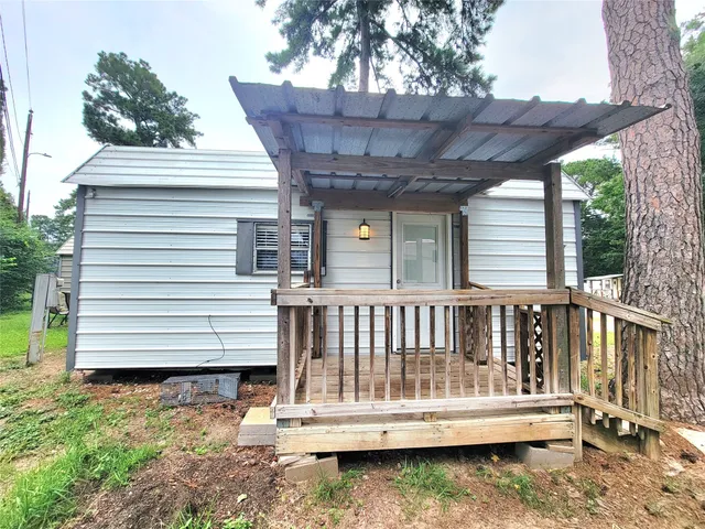 a view of a wooden deck with a bench