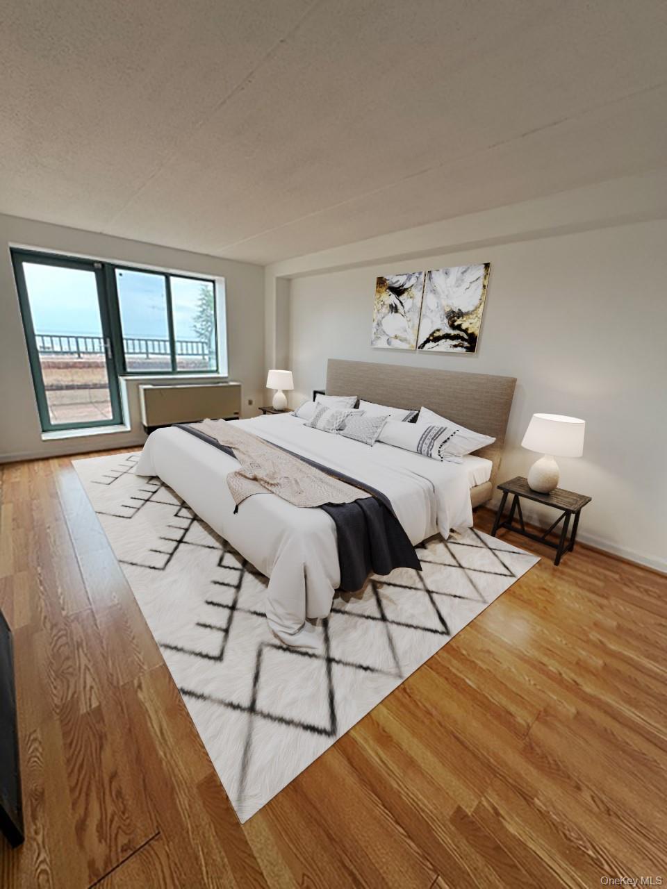 116-12 Ocean Promenade, Unit 706 Queens, NY 11694 - Photo 2 of 10 a bedroom with a bed and window