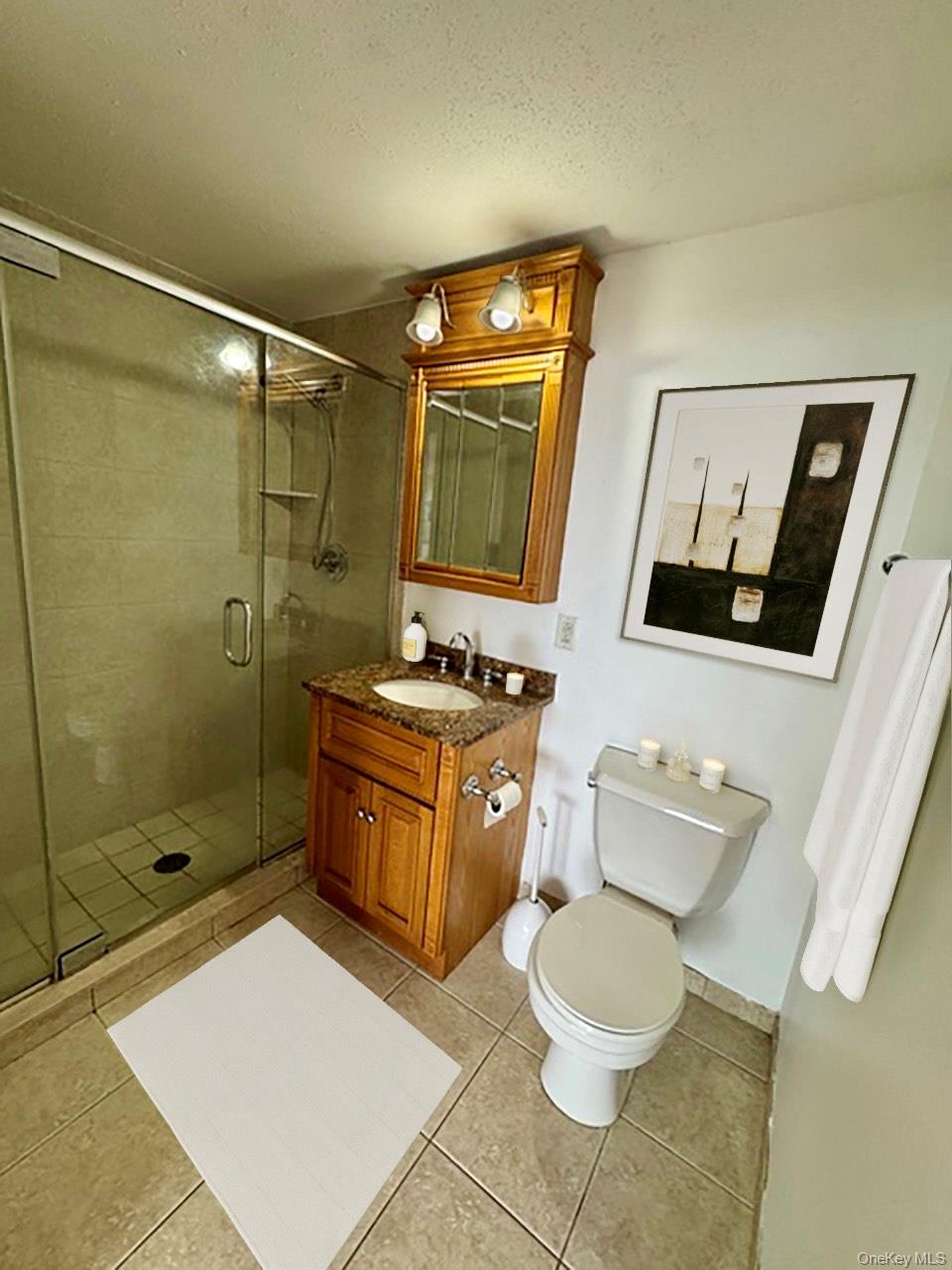 116-12 Ocean Promenade, Unit 706 Queens, NY 11694 - Photo 3 of 10 a bathroom with a toilet sink and mirror