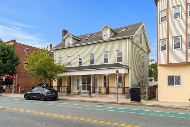 a black car parked in front of a building
