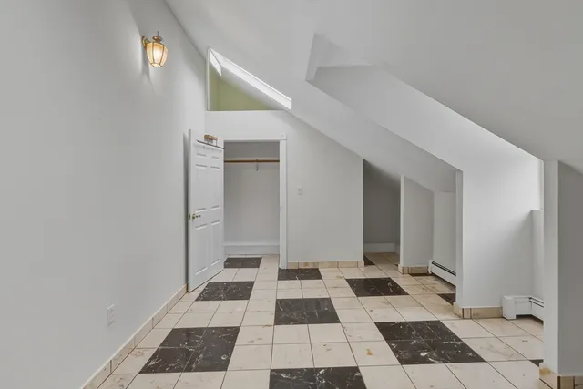 a bathroom with a toilet sink and shower