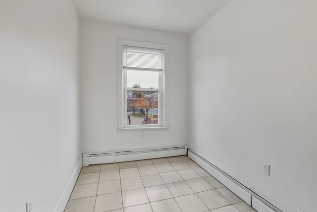 an empty room with white walls