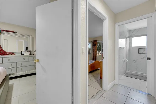 a bathroom with a tub and shower
