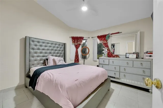 a bedroom with a bed and a dresser