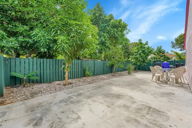 front view of a house with a tree