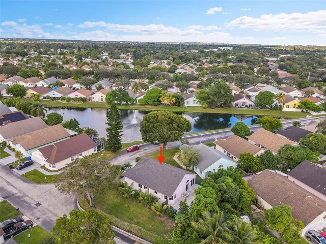 an aerial view of residential houses with outdoor space