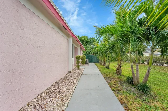 a view of a pathway with a yard