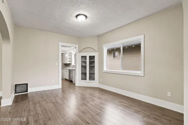 a white toilet sitting next to a shower