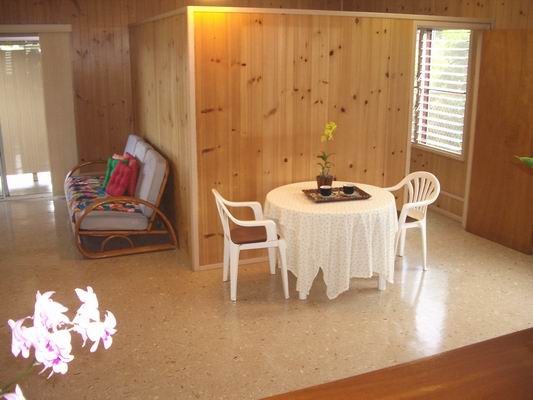 5200 Sokei Road Kapaa, HI 96746 - Photo 16 of 22 a dining room with furniture and wooden floor