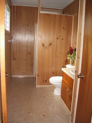 5200 Sokei Road Kapaa, HI 96746 - Photo 17 of 22 a bathroom with a toilet a sink and shower