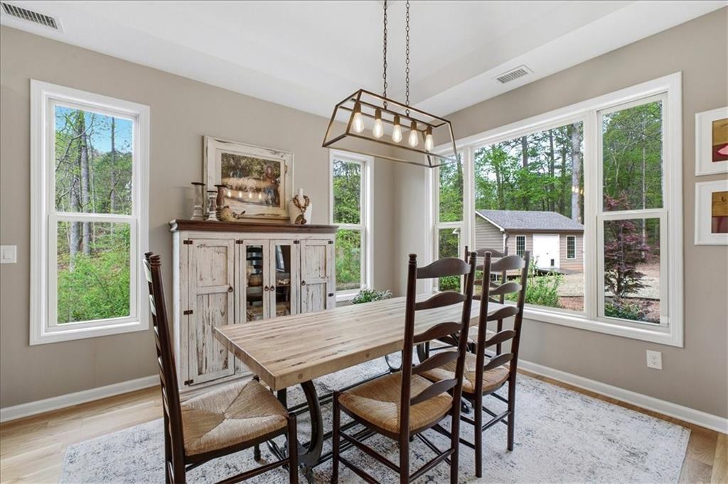 19 Pinoak Trail Cartersville, GA 30121 - Photo 16 of 55 a view of a dining room with furniture window and outside view