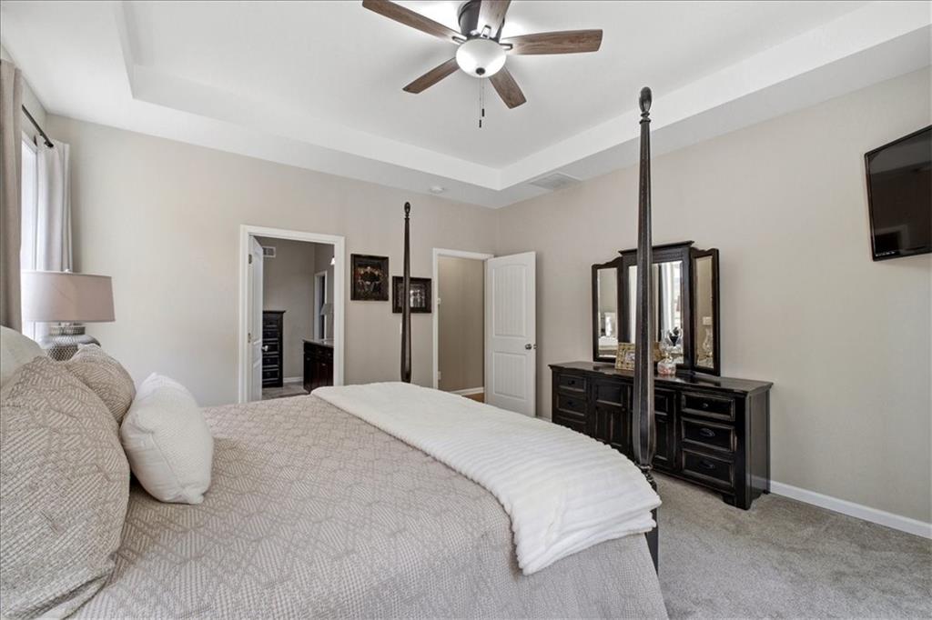 19 Pinoak Trail Cartersville, GA 30121 - Photo 23 of 55 a bedroom with a bed and a chandelier