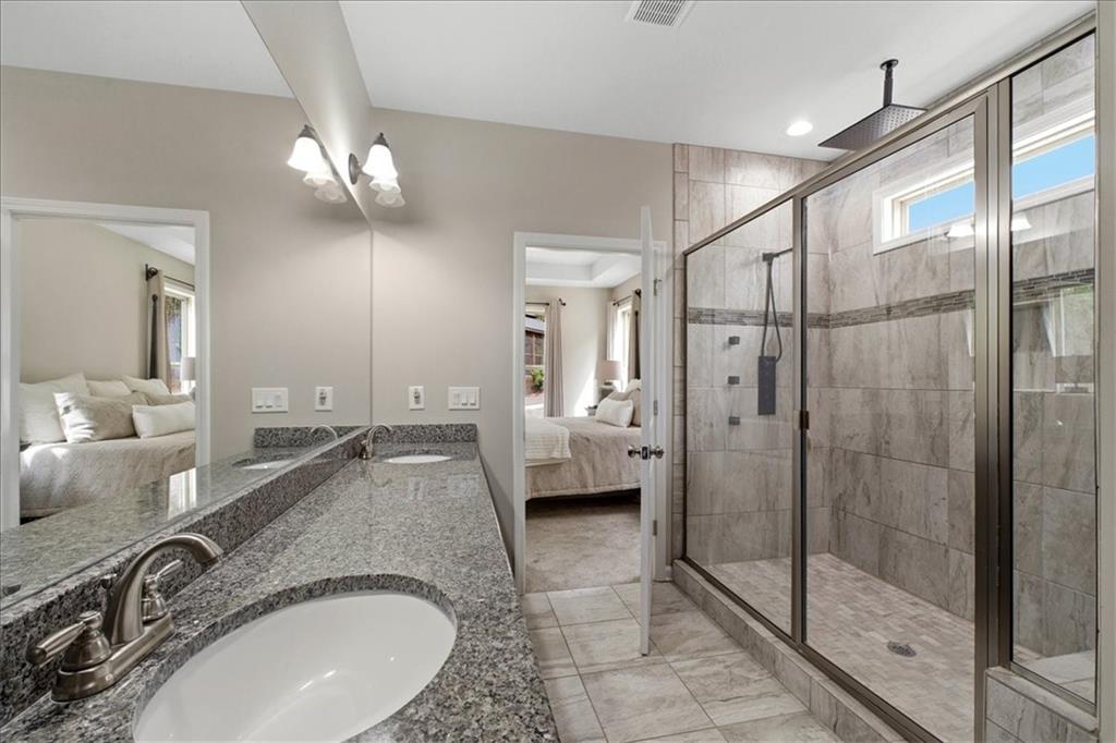 19 Pinoak Trail Cartersville, GA 30121 - Photo 26 of 55 a spacious bathroom with a granite countertop sink a mirror and shower