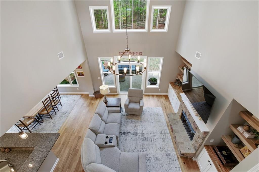 19 Pinoak Trail Cartersville, GA 30121 - Photo 27 of 55 a living room with furniture and a chandelier