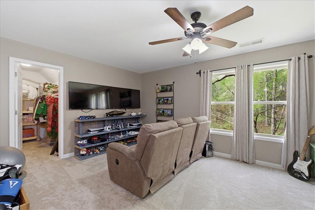 19 Pinoak Trail Cartersville, GA 30121 - Photo 28 of 55 a living room with furniture and a flat screen tv