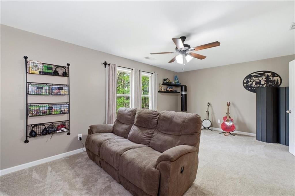 19 Pinoak Trail Cartersville, GA 30121 - Photo 29 of 55 a living room with furniture cabinets and window