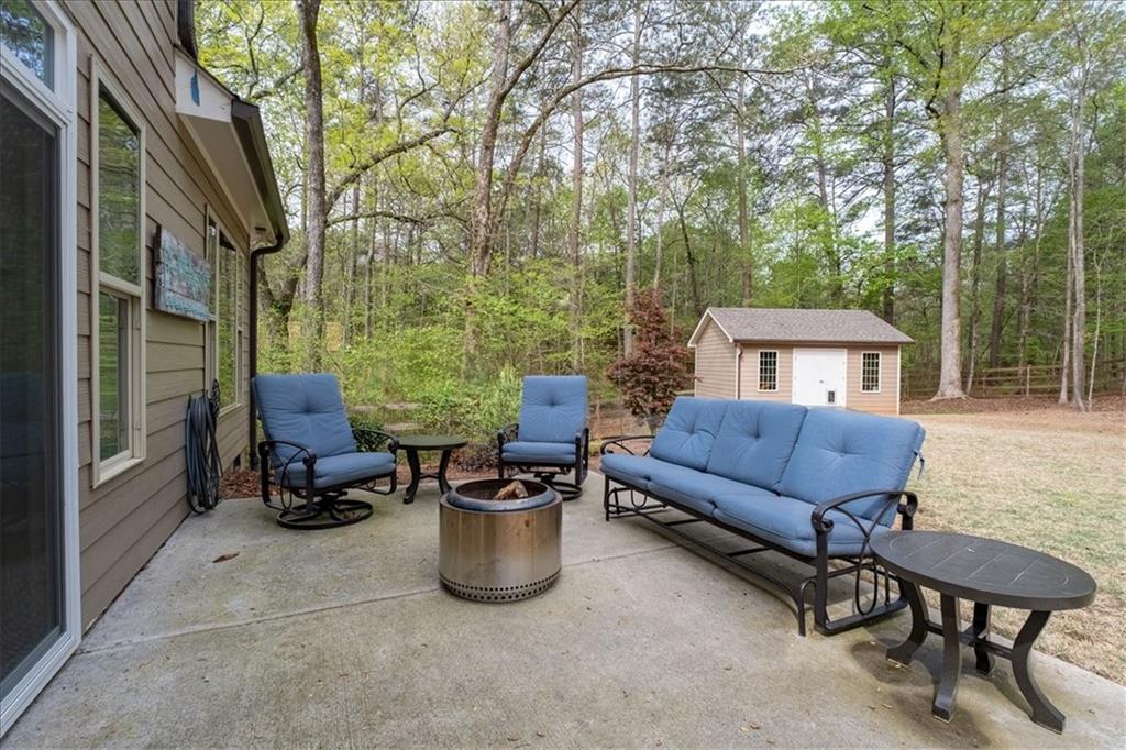 19 Pinoak Trail Cartersville, GA 30121 - Photo 36 of 55 a view of a patio with couple of chairs and a barbeque