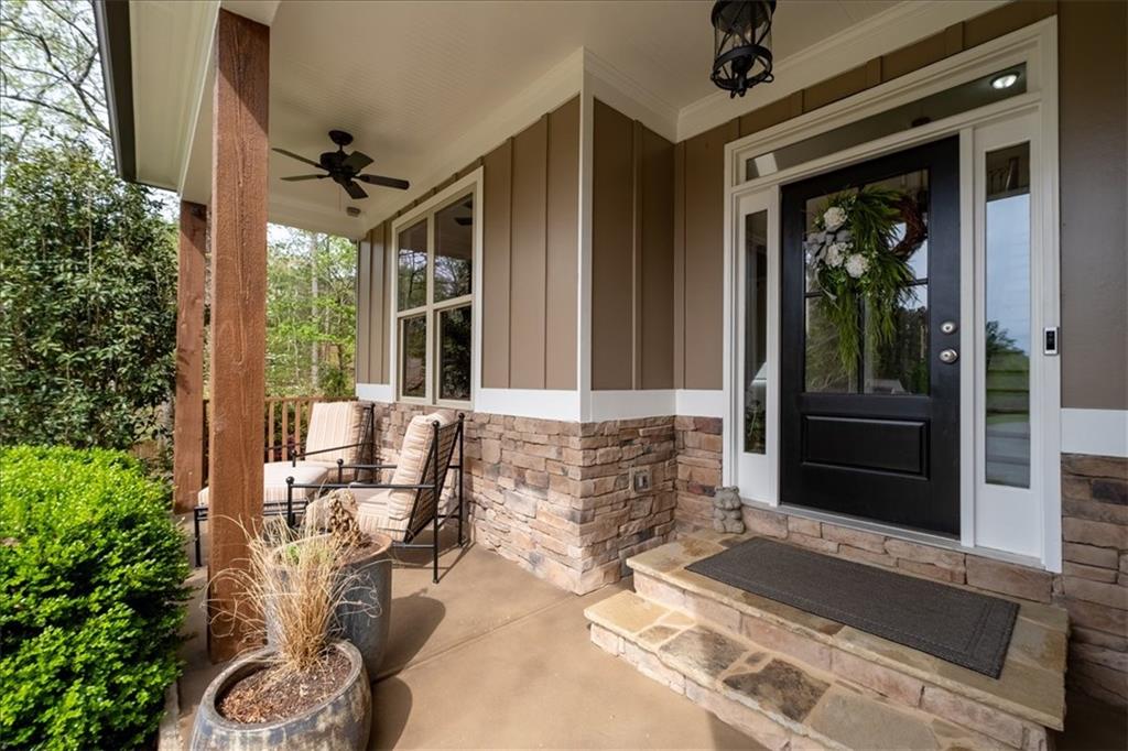 19 Pinoak Trail Cartersville, GA 30121 - Photo 4 of 55 a front view of a house with outdoor seating and plants