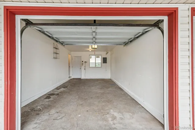 a view of a room with stairs and a ceiling fan