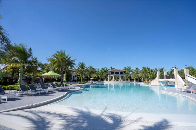 a view of a swimming pool with a table and chairs