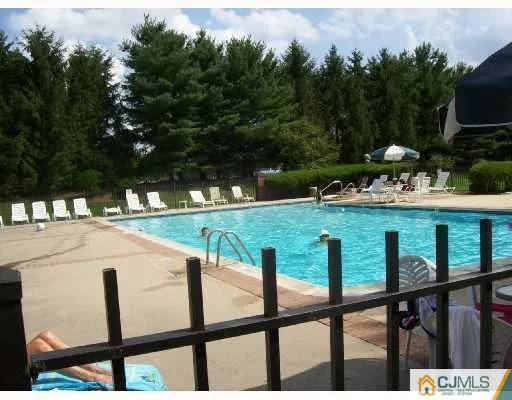 a view of swimming pool from a balcony