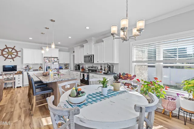 a kitchen with appliances a sink and cabinets