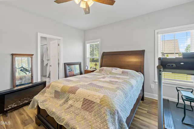 a bedroom with a large bed and a window