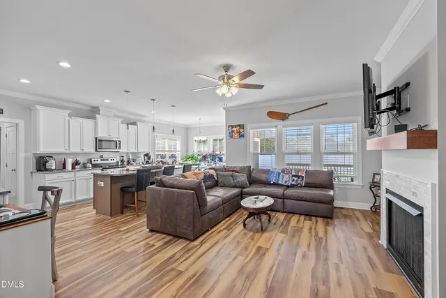 a balcony with couple of furniture and a garden