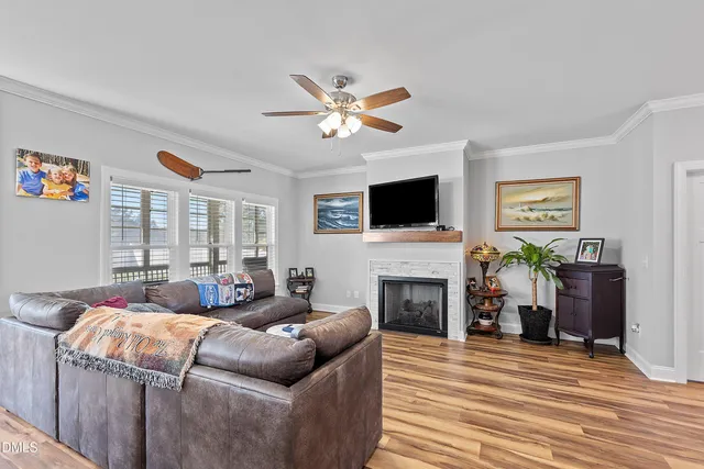 a living room with lots of furniture and kitchen view