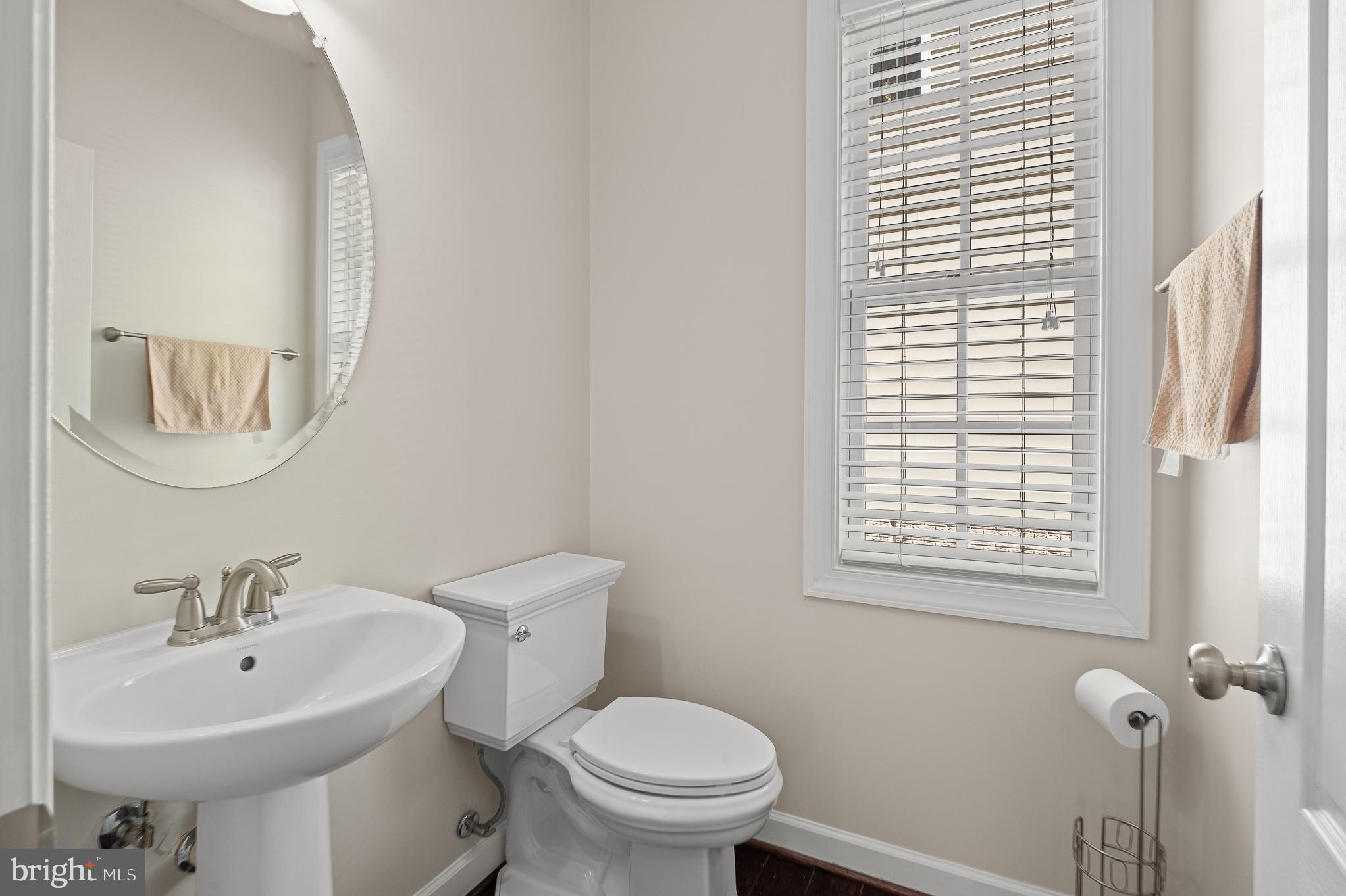 16862 Reef Knot Way Woodbridge, VA 22191 - Photo 11 of 99 a bathroom with a sink a toilet and a mirror