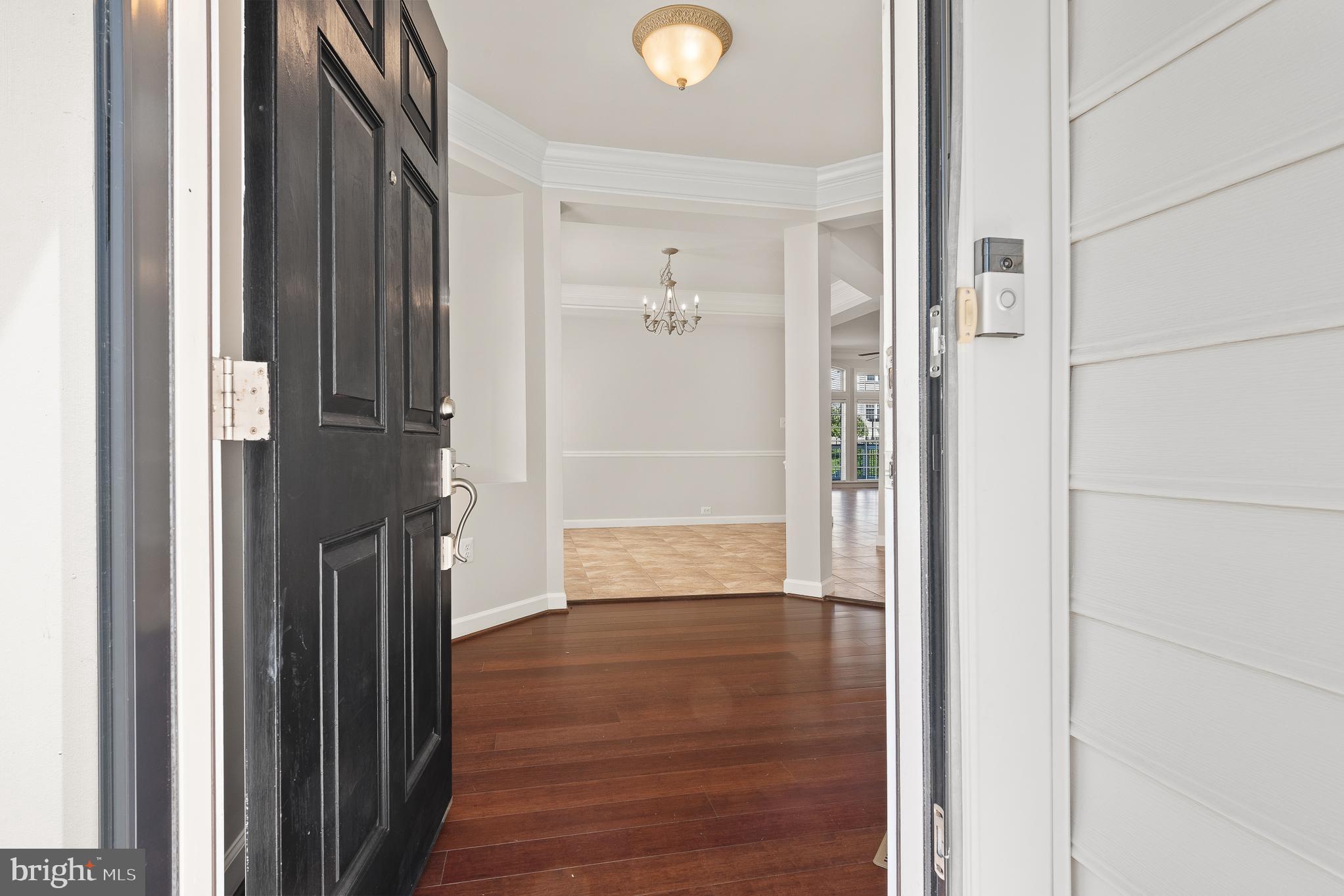 16862 Reef Knot Way Woodbridge, VA 22191 - Photo 2 of 99 a view of a hallway with wooden floor and closet