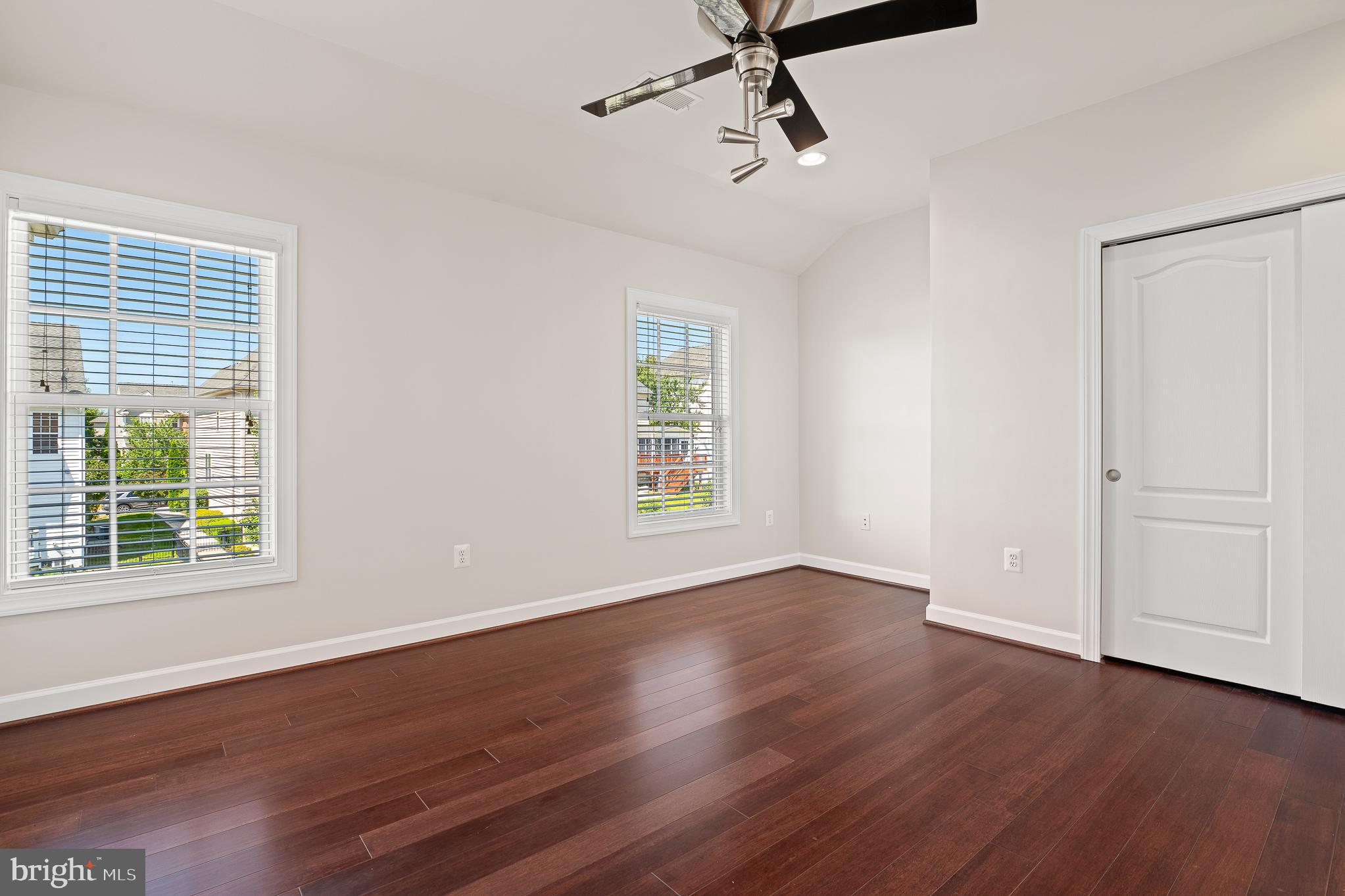 16862 Reef Knot Way Woodbridge, VA 22191 - Photo 35 of 99 a view of an empty room with wooden floor and a window