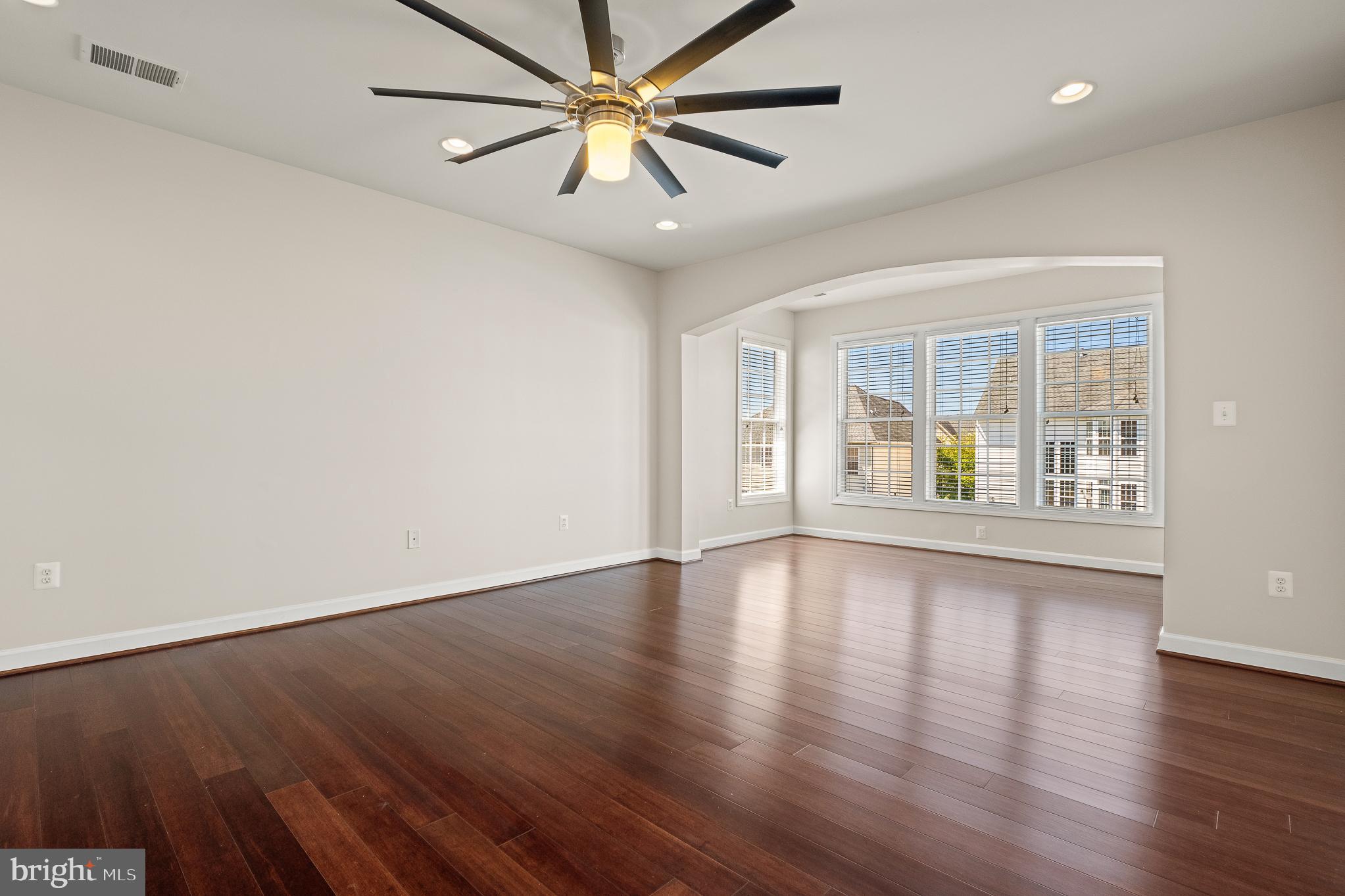 16862 Reef Knot Way Woodbridge, VA 22191 - Photo 39 of 99 a view of an empty room with window and wooden floor