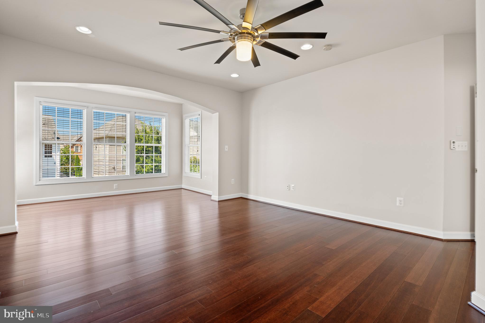 16862 Reef Knot Way Woodbridge, VA 22191 - Photo 40 of 99 an empty room with wooden floor and windows