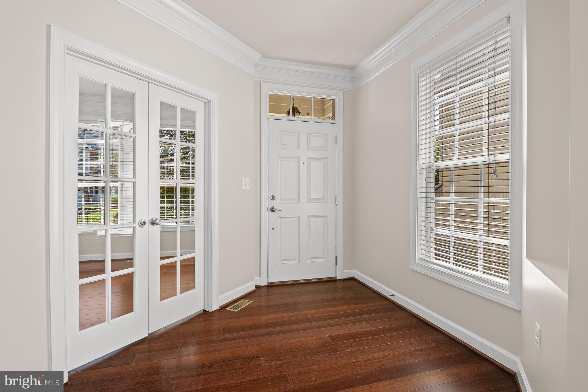 16862 Reef Knot Way Woodbridge, VA 22191 - Photo 4 of 99 an empty room with wooden floor and windows