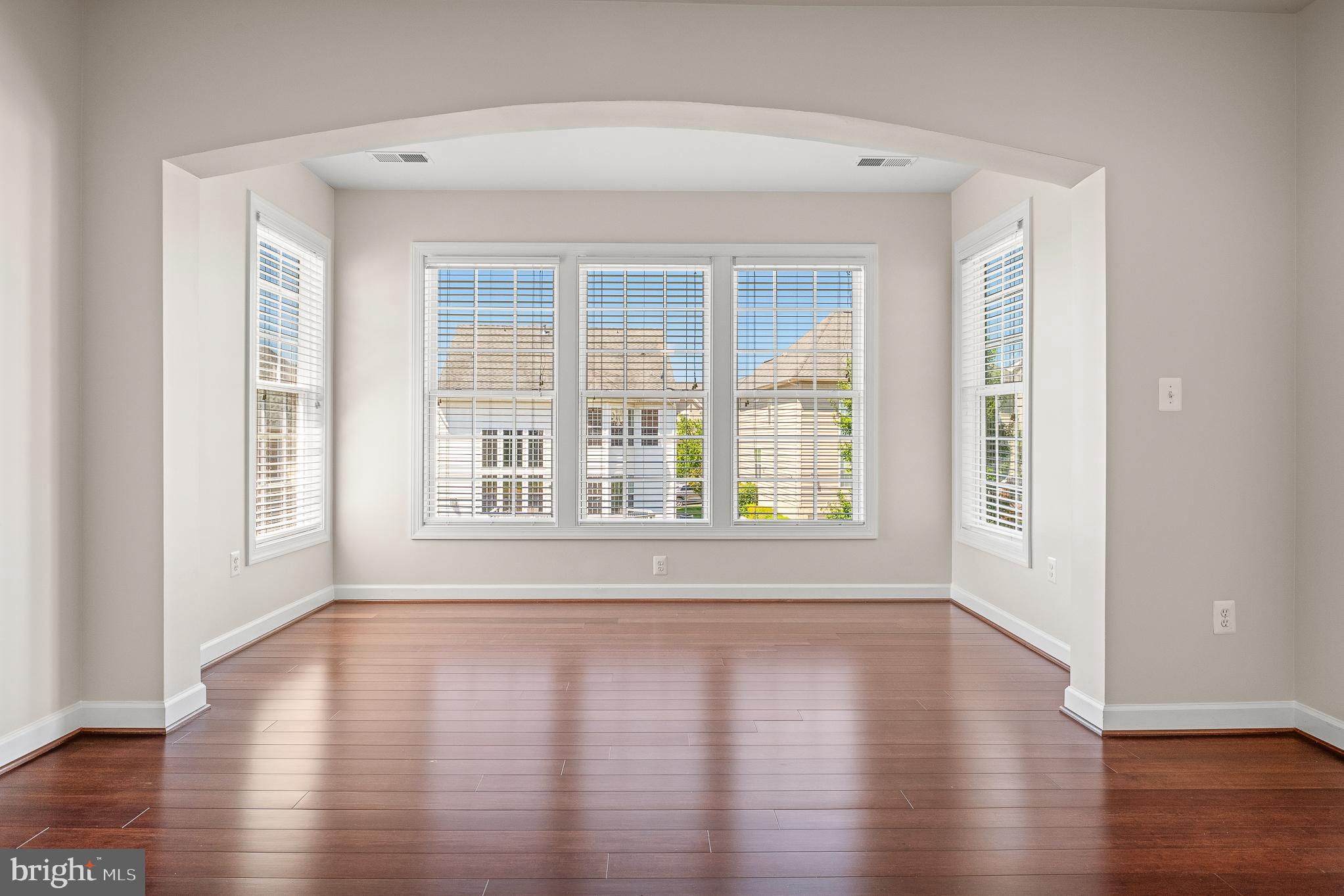 16862 Reef Knot Way Woodbridge, VA 22191 - Photo 41 of 99 a view of an empty room with wooden floor and a window