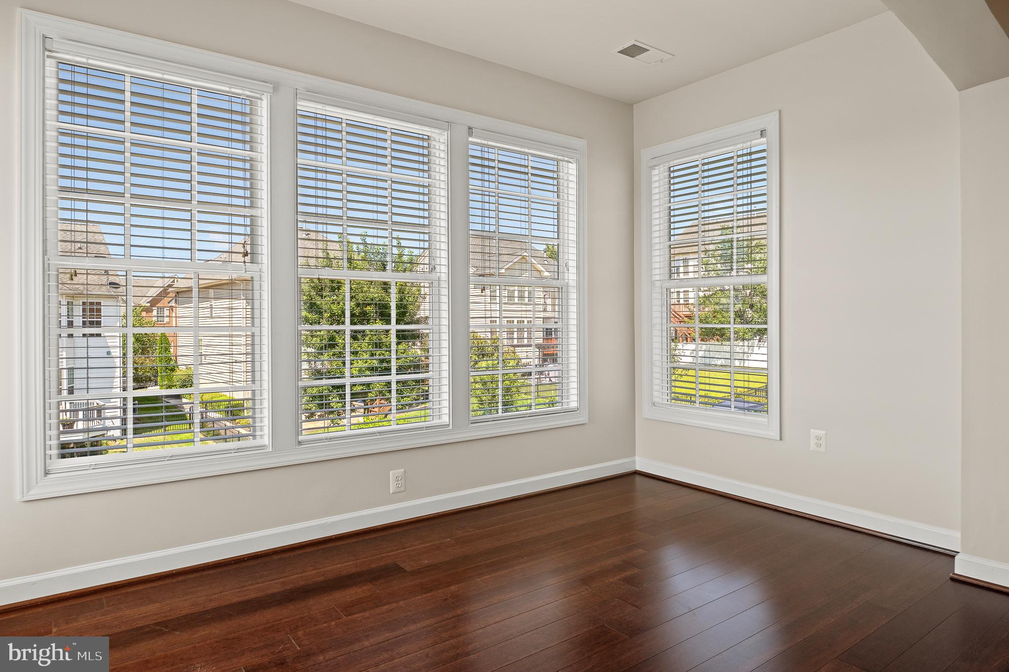 16862 Reef Knot Way Woodbridge, VA 22191 - Photo 42 of 99 a view of an empty room with wooden floor and a window