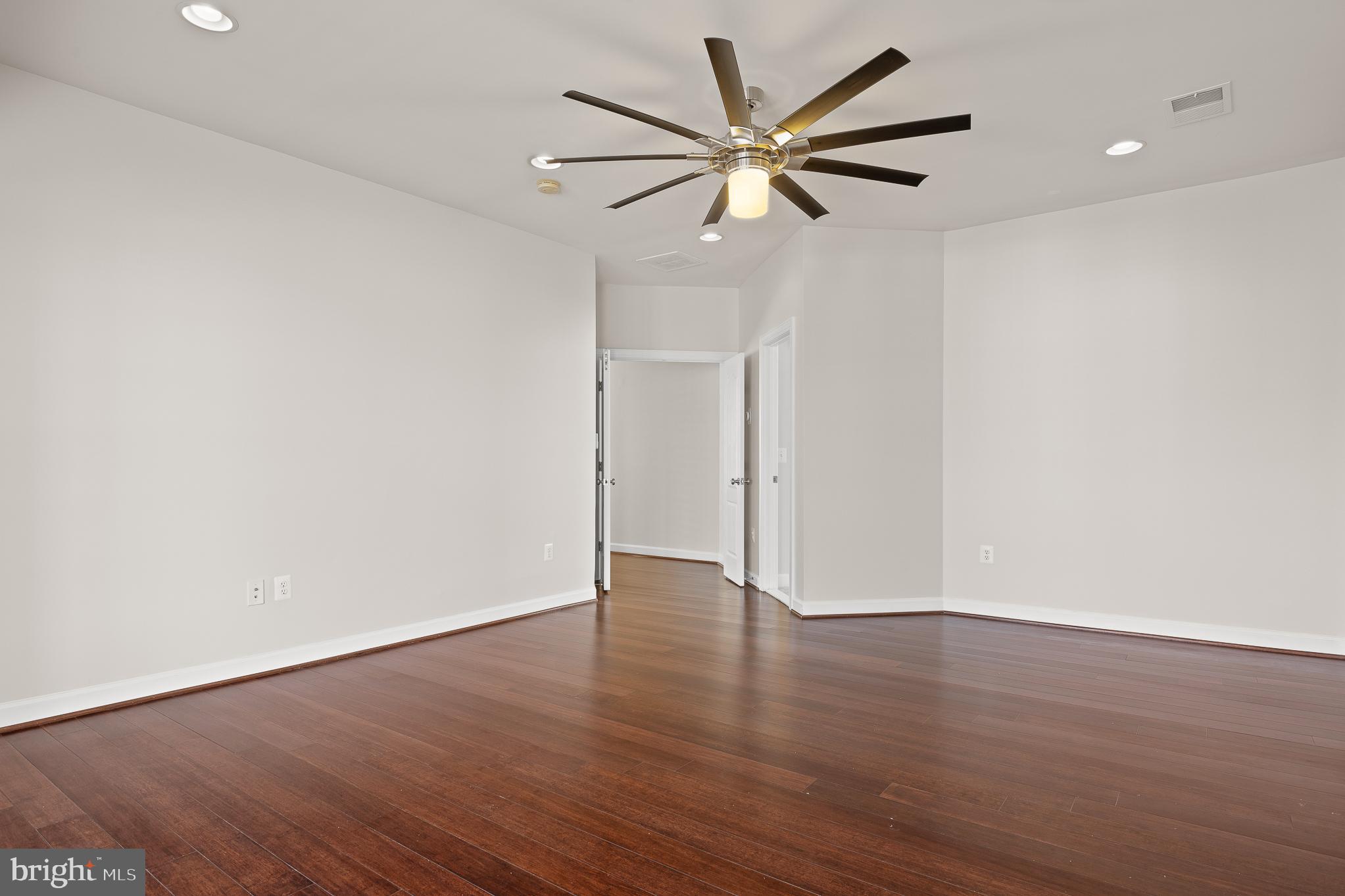 16862 Reef Knot Way Woodbridge, VA 22191 - Photo 45 of 99 an empty room with wooden floor and windows